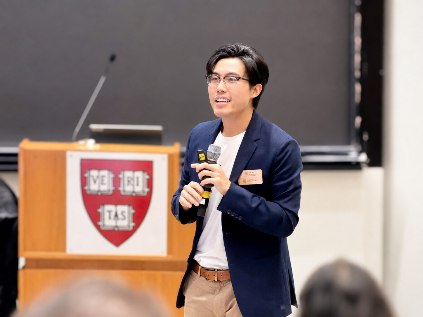 Jeff Cai speaking at a lecture